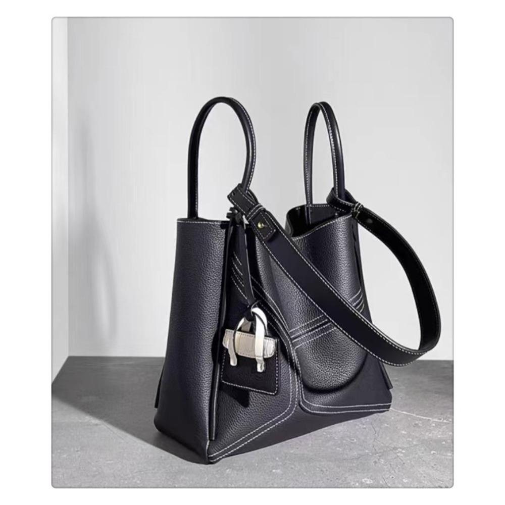 

Новая сумка из коровьей кожи высшего слоя, большая сумка, геометрическая сумка, большая вместимость, ощущение высокого класса, сумка-тоут через плечо, подмышку, женская сумка 28CMx11x25CM чёрный