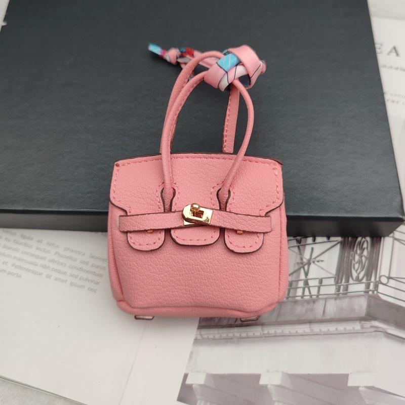 

New Style Mini Cowhide Bag Accessories High-Grade Wallet Headphone Bag Pendant Car Key Chain Pendant Expansion 8.5x4.5x11cm світло-рожевий колір