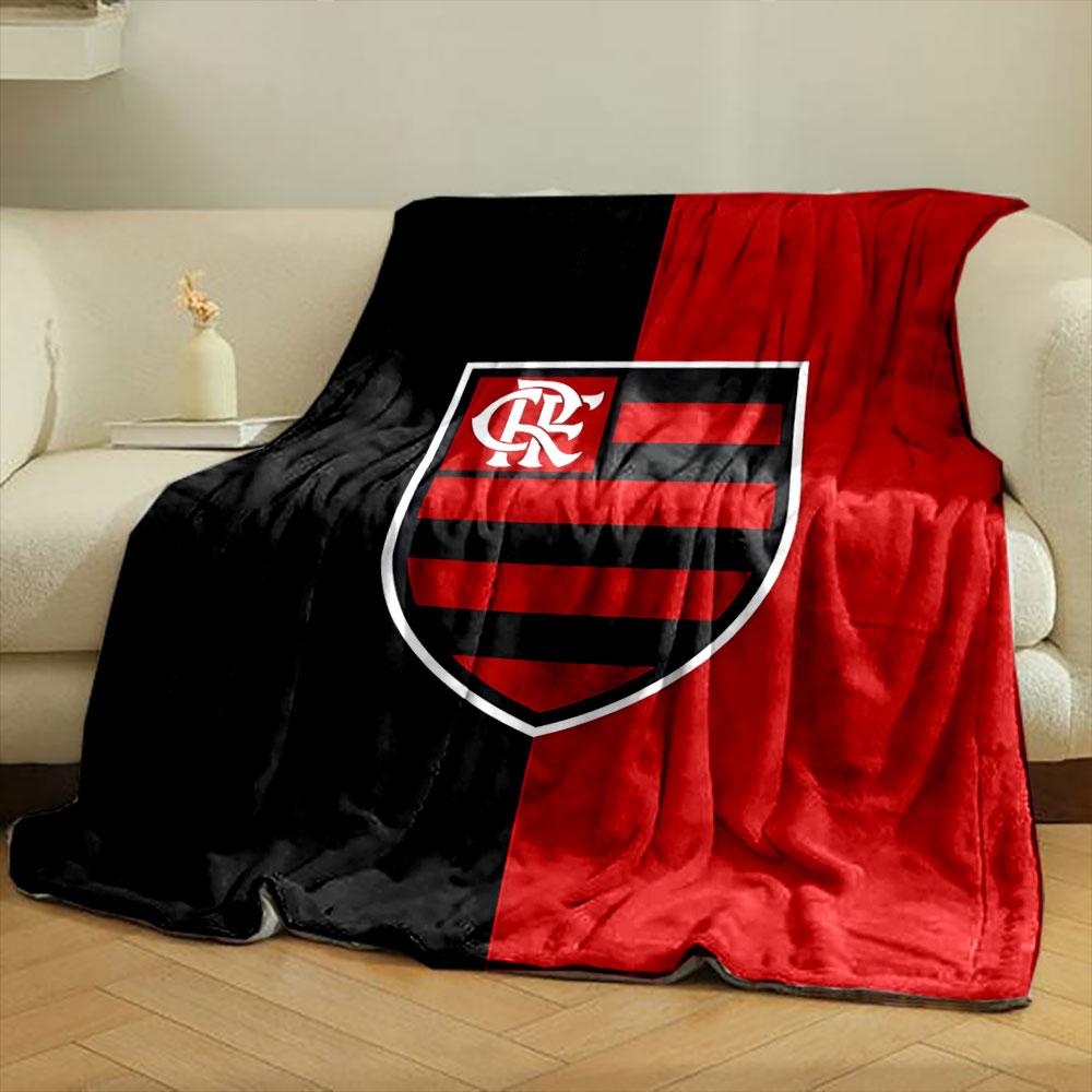 A vertically split black and red background with a striped shield emblem. for all seasons blanket lunch break throw gift