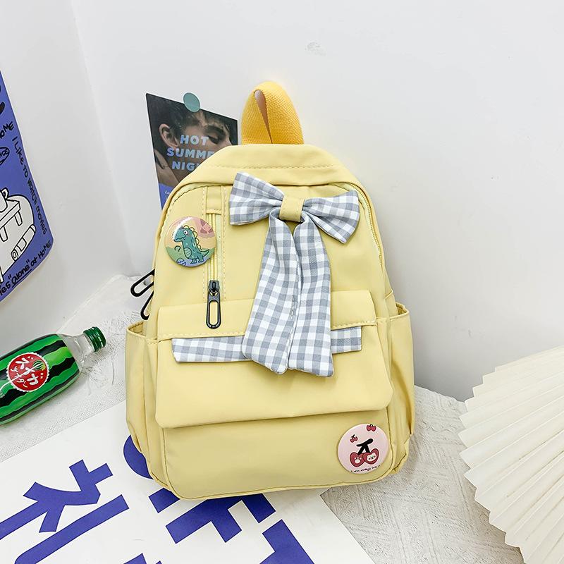 

Bow schoolbag Female primary school students Large capacity 3rd to 6th grade high school lightweight weight weight reduction Cute simple backpack жовтий