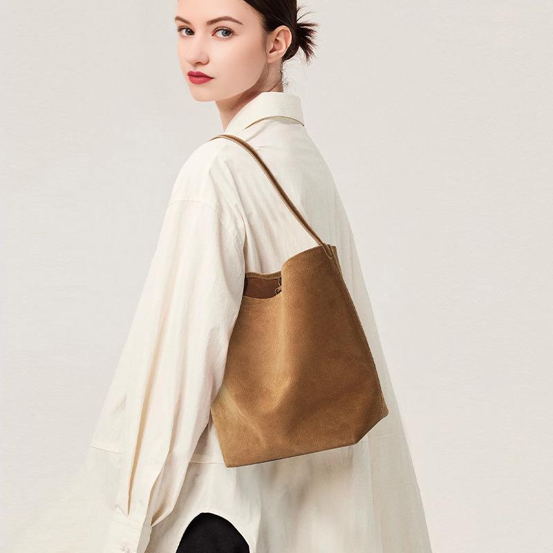 Retro suede suede premium bucket bag, matte cowhide large-capacity portable shoulder tote bag.