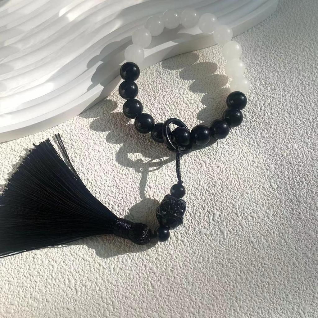Obsidian Gradient Tassel Jade-Style Phone Charm with Antique Lion Dance Design