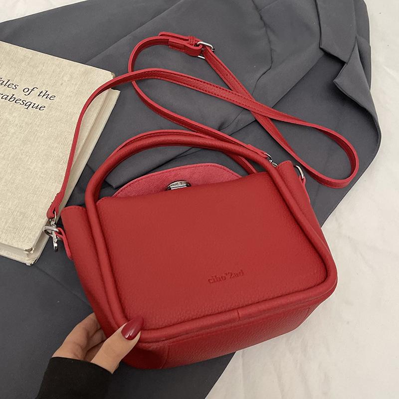 

Wholesale hot sale Korean simple style lychee pattern portable child and mother bag fashionable versatile commuter advanced sense messenger bag women