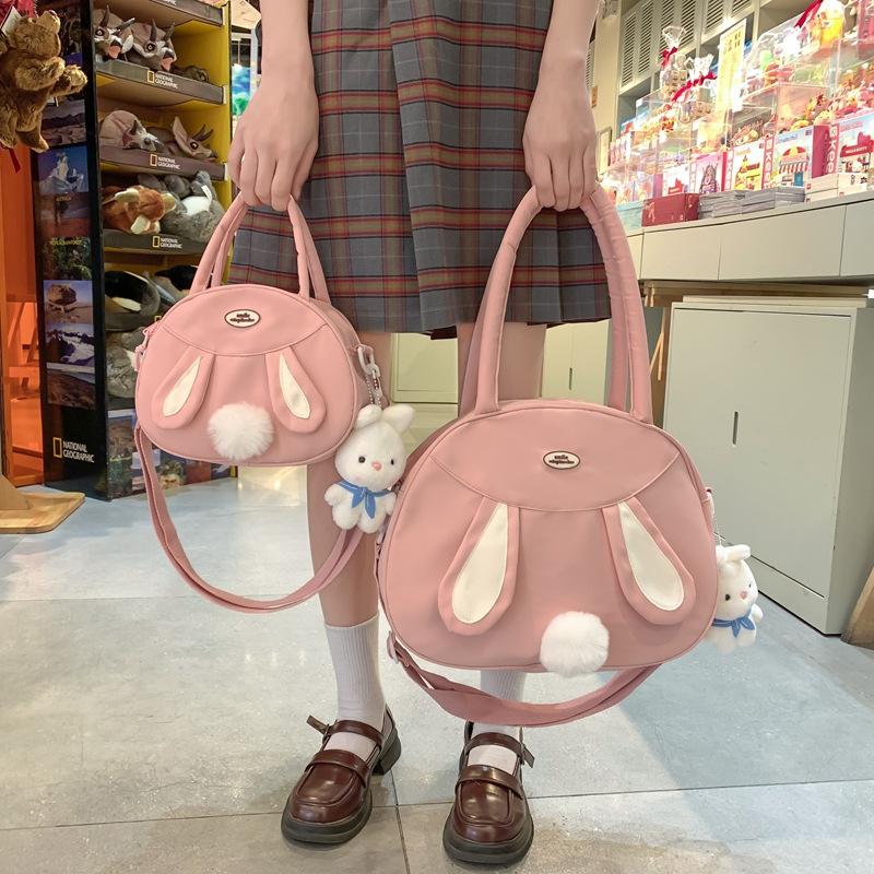 Tasche neue Umhängetasche Schultertasche koreanische Version Puppenanhänger niedliches Kaninchen Plüschtasche Canvas große Kapazität Handheld Tide