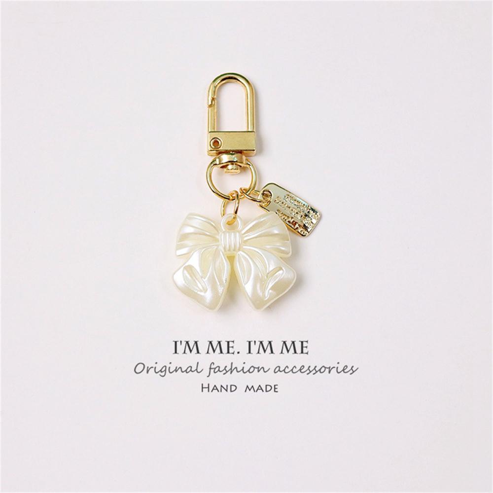 Niedlicher Perlenblumen-Schlüsselanhänger Glänzendes Muschelblatt-Schlüsselanhänger Metallanhänger Zubehör für Damen Auto Anhänger Taschenanhänger Schmuck