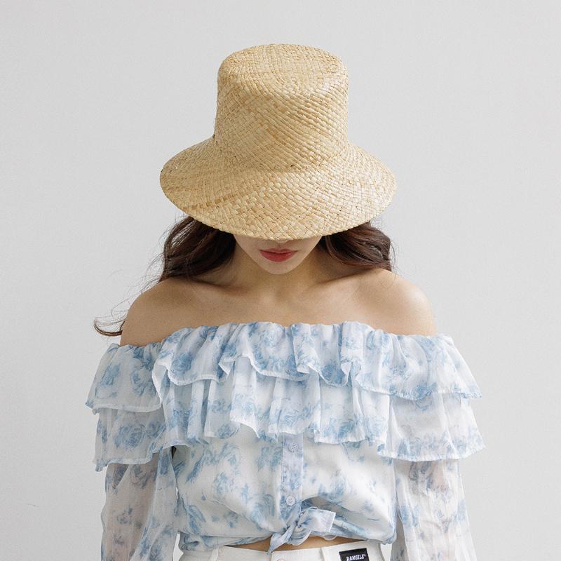 2025 New Arrival Hand-made Hollow Raffia Sun Hat Spring and Summer Fashion Retro Flat Top Outdoor Sunshade Straw Hat Bucket Hat