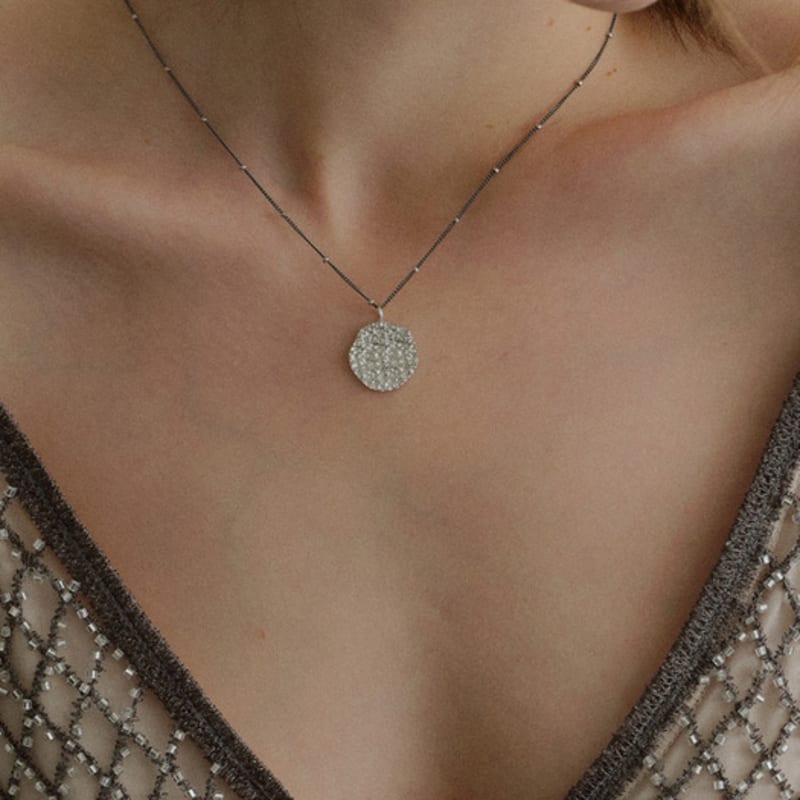 

THE PART OF Sparkling Sand Coin Black_N ONE