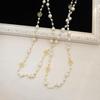 Korean Long Pearl Necklace: Trendy Multi-layer Hollow Flower Sweater Chain for Women