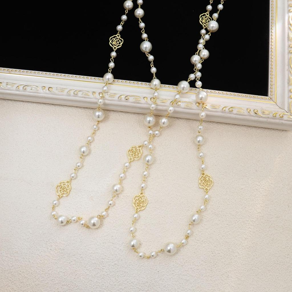 Korean Long Pearl Necklace: Trendy Multi-layer Hollow Flower Sweater Chain for Women