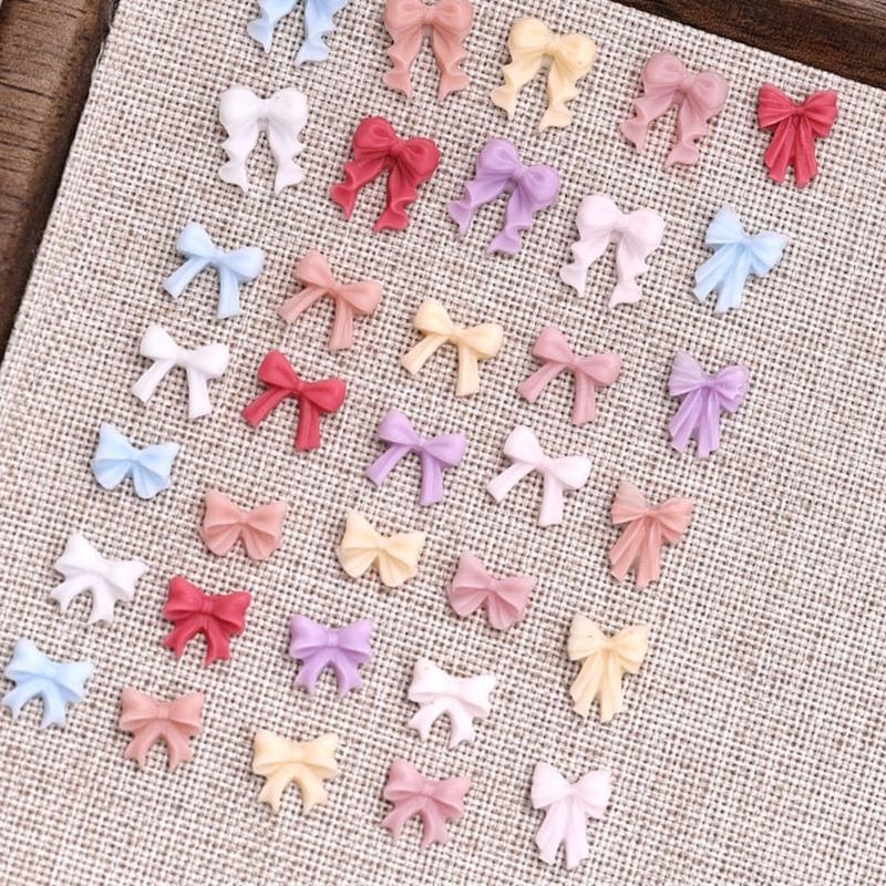 50 Stück Schleifen Nagelanhänger Einfache Schleife Nagelkunst Dekorationen Schleifen Designs Nagelzubehör Harzschleifen Nagel Strasssteine Geschenke