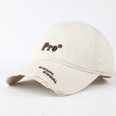 A Simple Korean Style Baseball Cap with A Small Embroidered Face Featuring A Perforated and Curved Brim