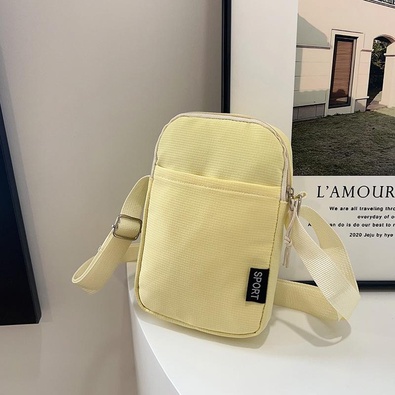 Multi-color mobile phone bag, large-capacity shoulder bag, simple and fashionable messenger bag, solid color change bag, nylon small backpack.