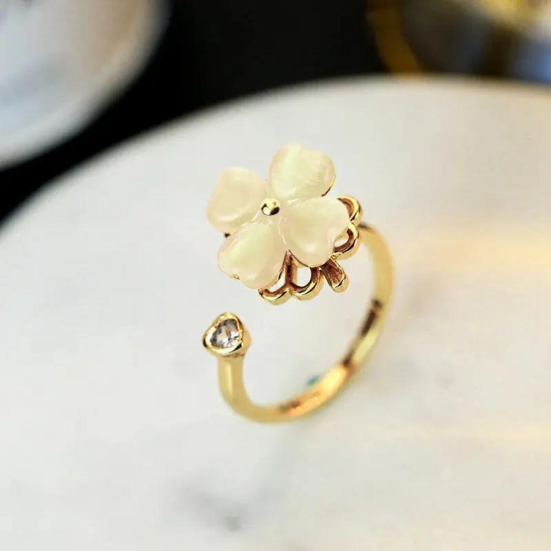 1 Stück neuer Mode drehbarer vierblättriger Zirkon offener verstellbarer Ring Luxus Nischendesign High-End Sinn für Schmuck