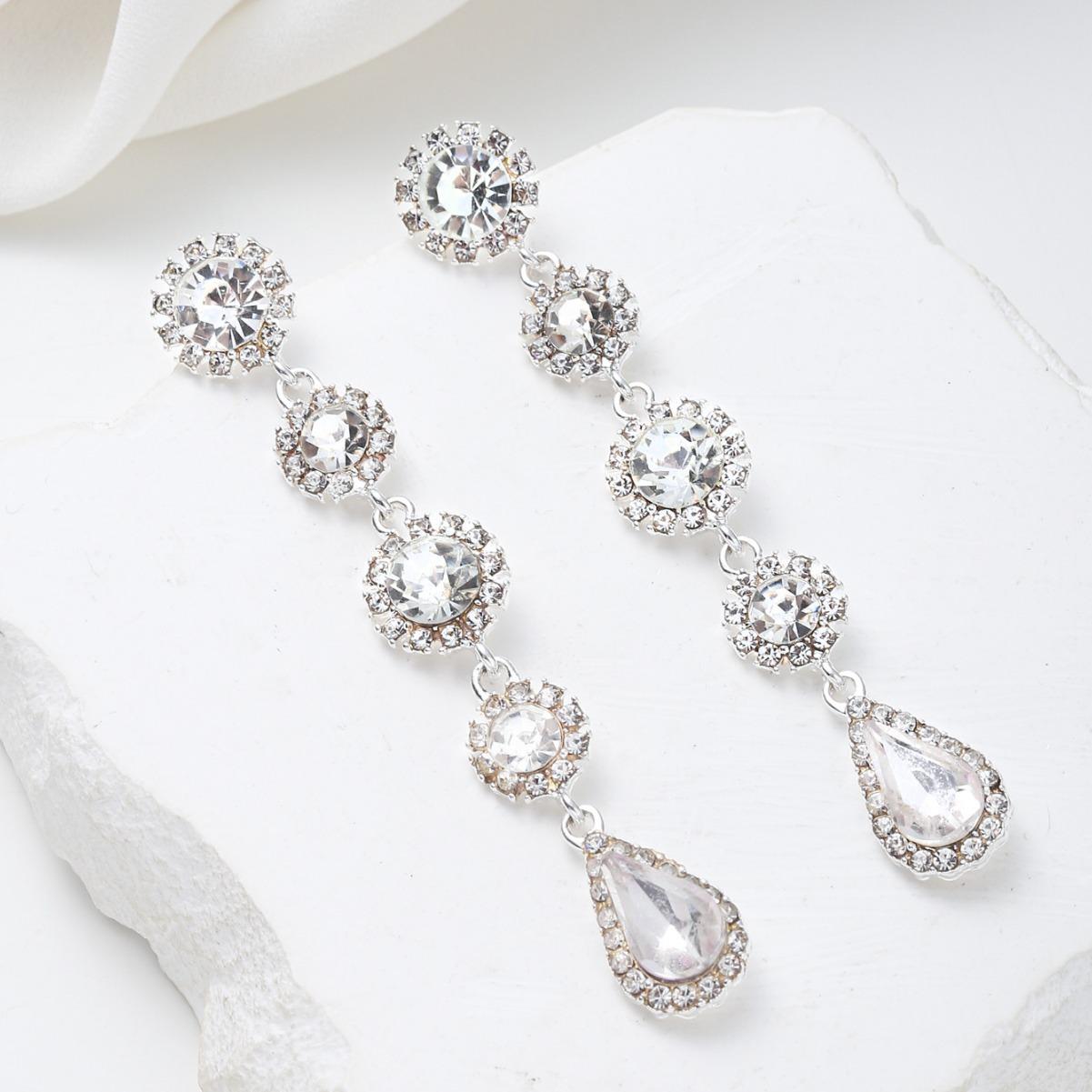 

Новые американские ретро серьги универсальные длинные серьги с бахромой инкрустированные белым кристаллом серьги-пусеты в виде капли воды женские ins универсальные