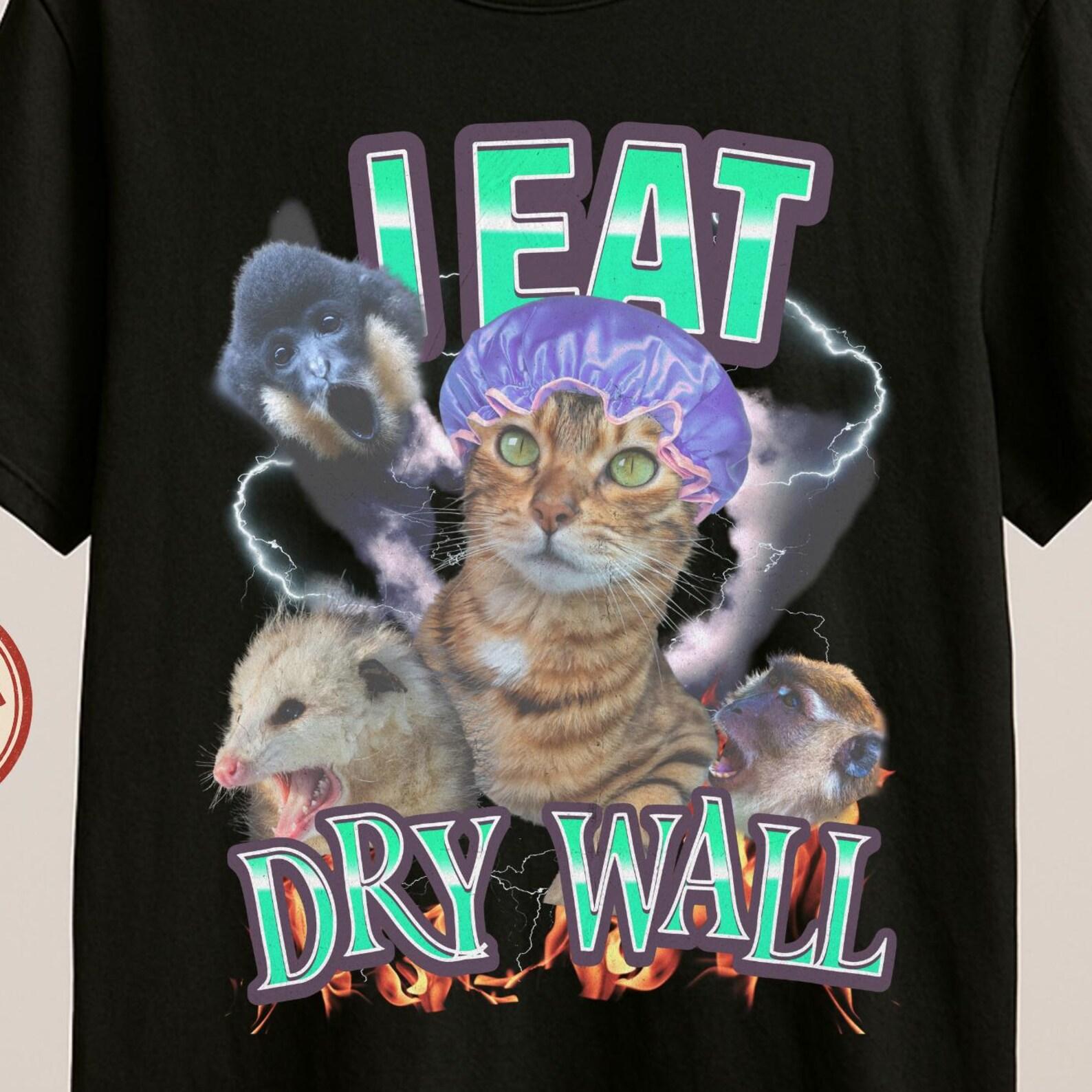 Stylish I Eat Dry Wall Shirt – Funny Chaos Cat Meme T-Shirt, Unhinged Animal Graphic Tee, Surreal Humor Cat Shirt. S