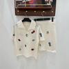 European Heavy Embroidery Cartoon Knit Two-Piece Set: Short Sleeve Lapel Top & Skirt