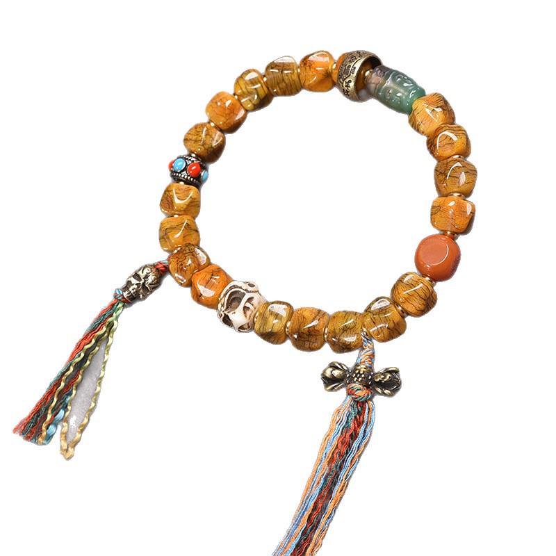 Buddhistisches Gebetsperlenarmband aus tibetischem Yakknochen und Passionsfruchtsamen