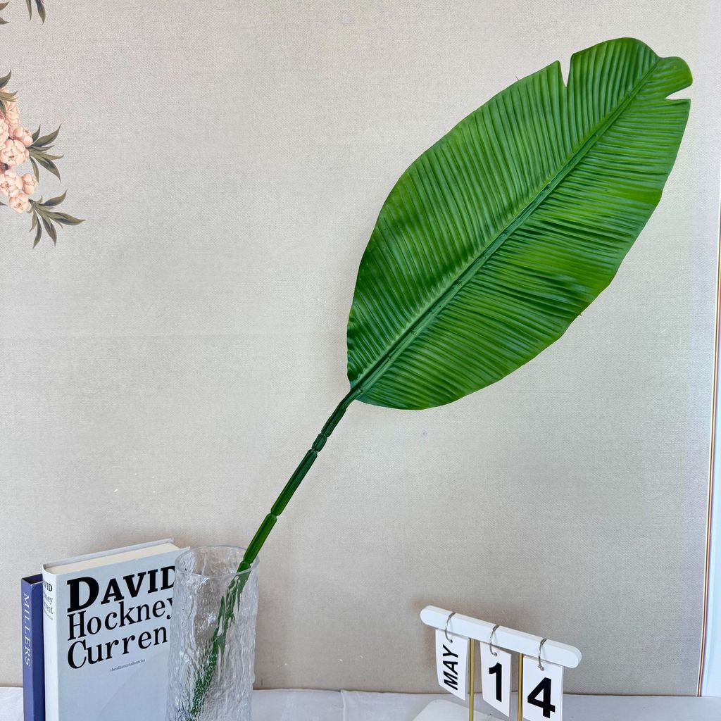 Dekoration i form av en falsk bananbladsfläkt för bröllop och heminredning