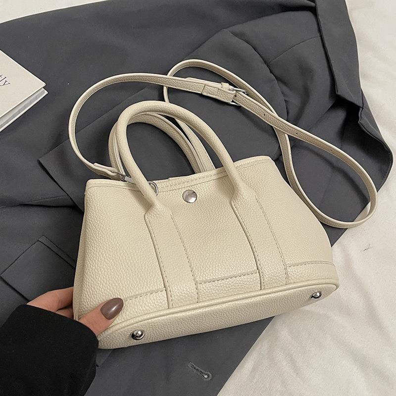 Spring and Summer Hot Sale Dopamine Color Sweet Simple Portable Bucket Bag Korean Version Fashion Commuter Versatile Messenger Women's Bag