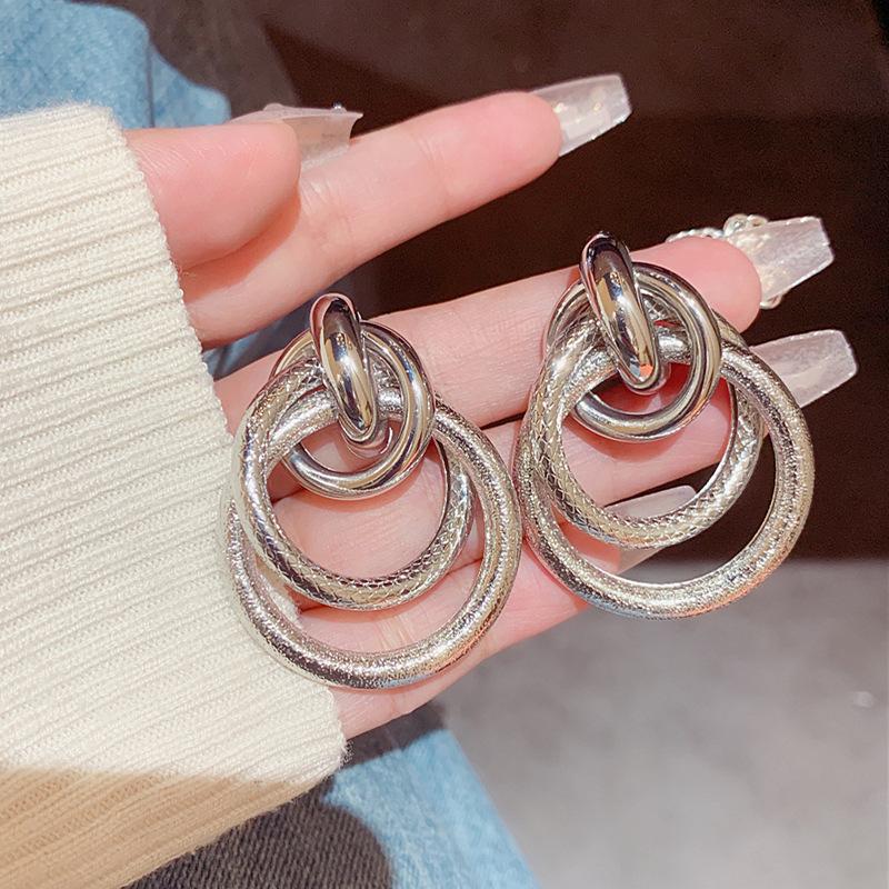 

European and American personality trend hollow ring earrings 111 silver needle exaggerated retro geometric metal cross earrings 925 silver needle