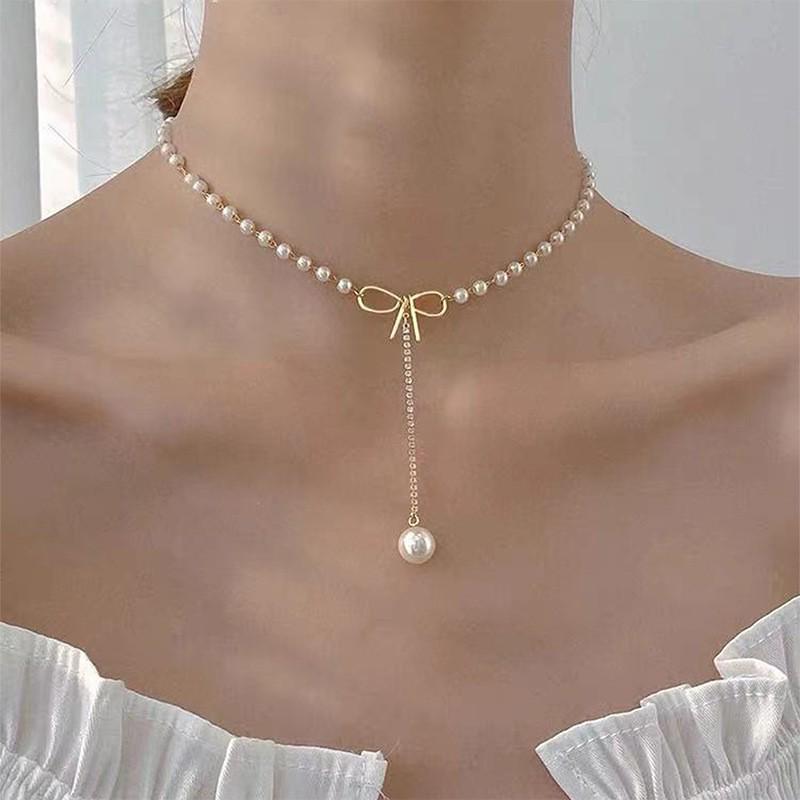 Elegant Pearl Bowknot Tassel Pendant Necklace: High-End Autumn Winter Women's Fashion