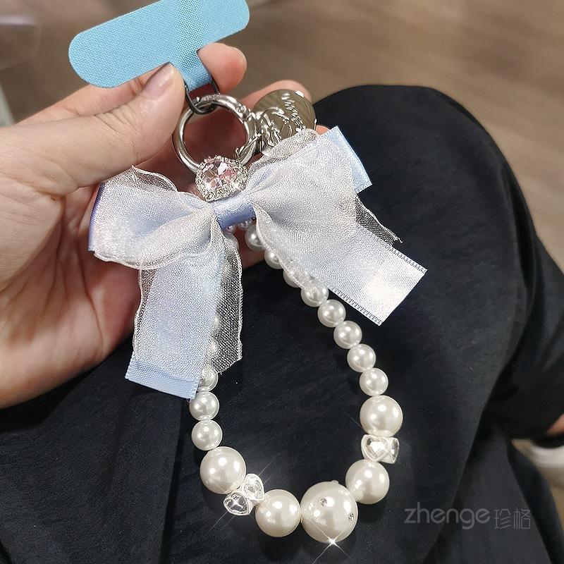 Mesh bow pearl bracelet women's ins fashion Xiaoxiangfeng mobile phone pendant mobile phone lanyard short wrist