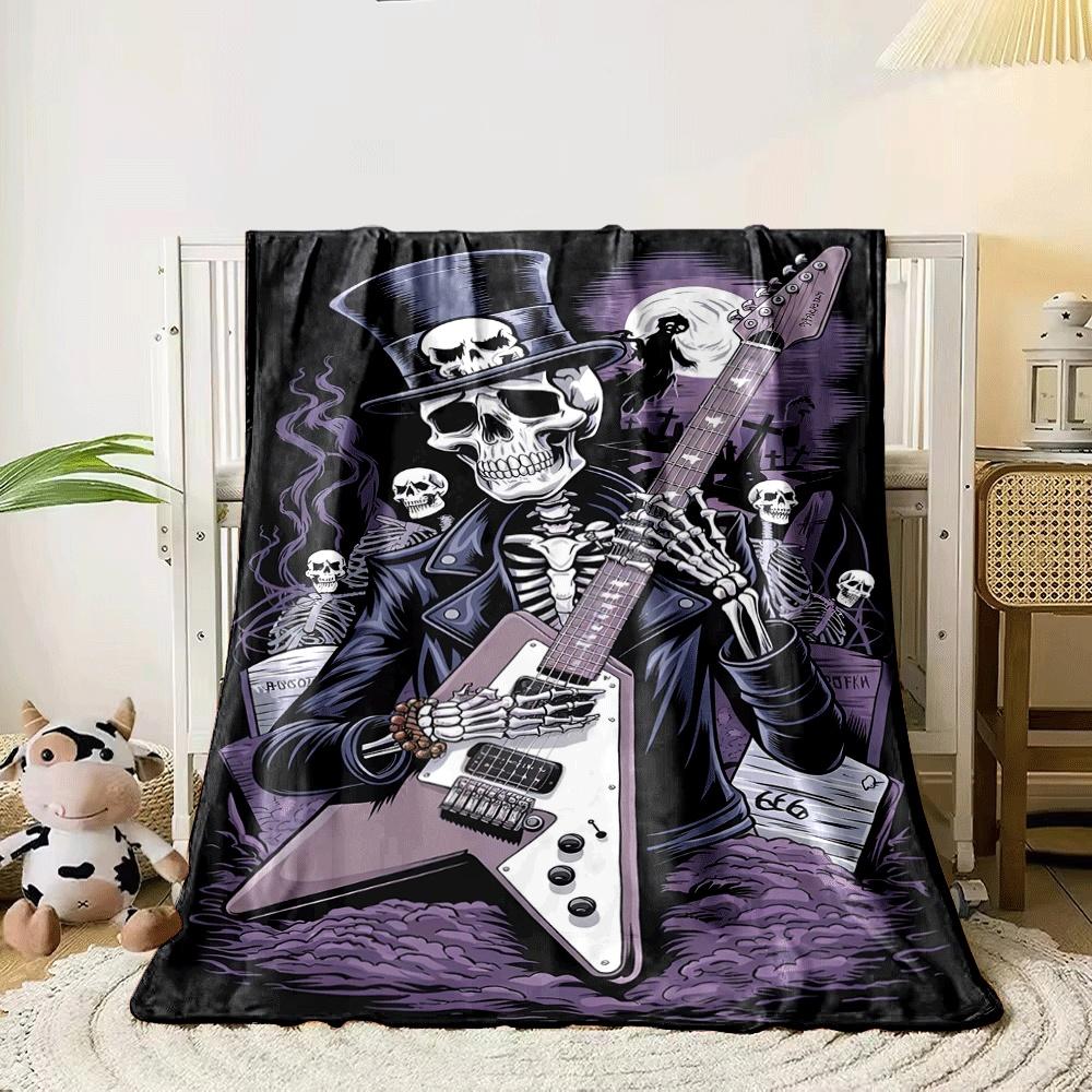 A skeleton in a top hat plays an electric guitar in a graveyard scene. for all seasons blanket lunch break throw gift 80cm x 120cm