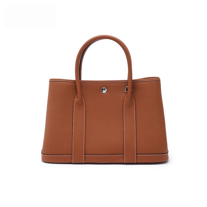 

Женская сумка-тоут из натуральной кожи - Коллекция весна/лето 2024, Большая вместимость, Мягкая текстура, Модная сумочка 31*13*21 cm светло-коричневого