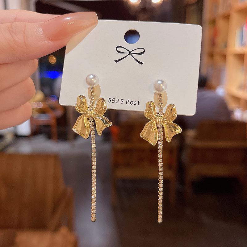 

Серьги-кисточки с жемчугом и бантом из серебра S925