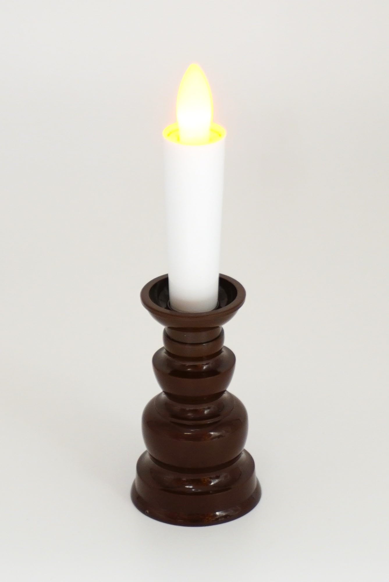 

Safe, flameless LED electric candle with brown base, 14cm tall, turns on and off with one push. Not included.