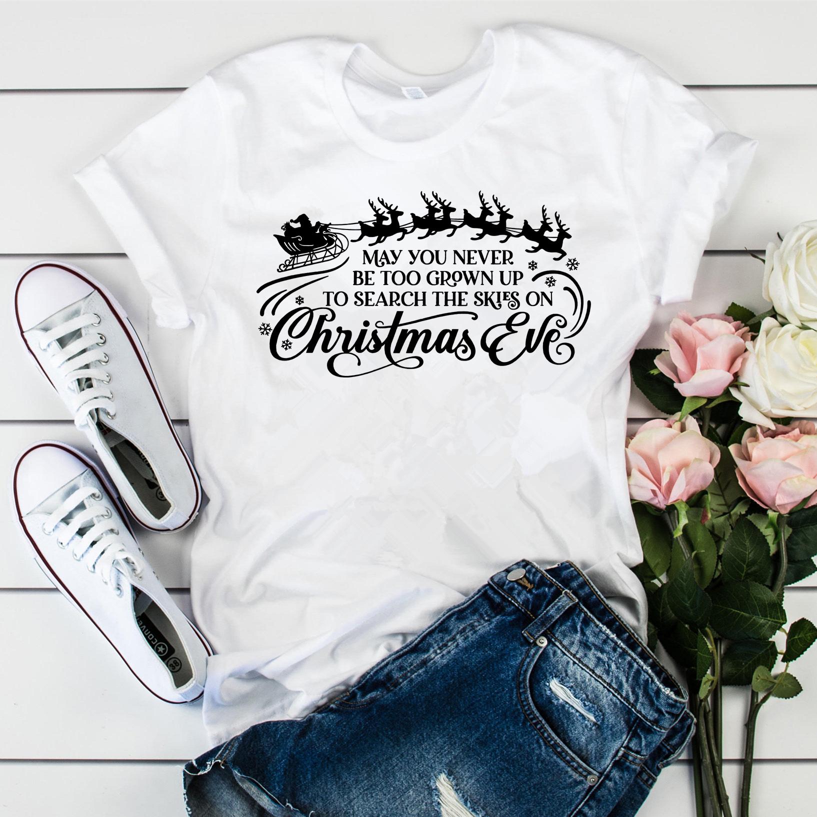 

May you never grow up Tshirt funny Christmas shirt retro 90s Christmas Eve holiday Tshirt Santa Claus pattern Womens Tshirt 4XL