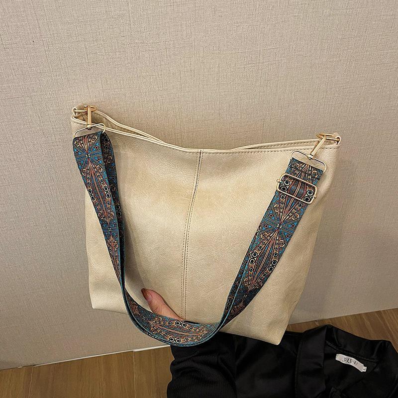 2025 Retro Shoulder Bags: Women's Large Capacity Wide-Band Messenger Bags - Spring/Summer Advanced Texture Bucket Design.