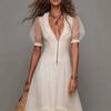 The new V-neck European and American women's clothing holiday style white ruffle edge loose dress is popular.