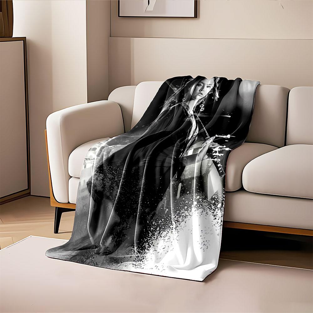 A woman holding a sword in a dynamic, monochromatic composition. for all seasons blanket lunch break throw gift