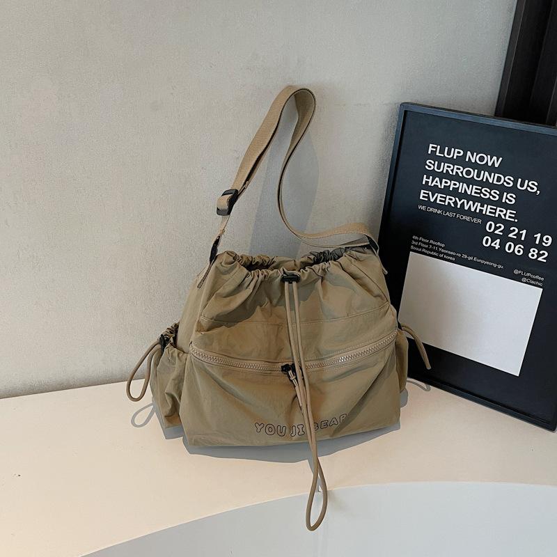 Large capacity casual tote canvas bag women's light drawstring bucket bag travel bag simple commuter shoulder crossbody bag