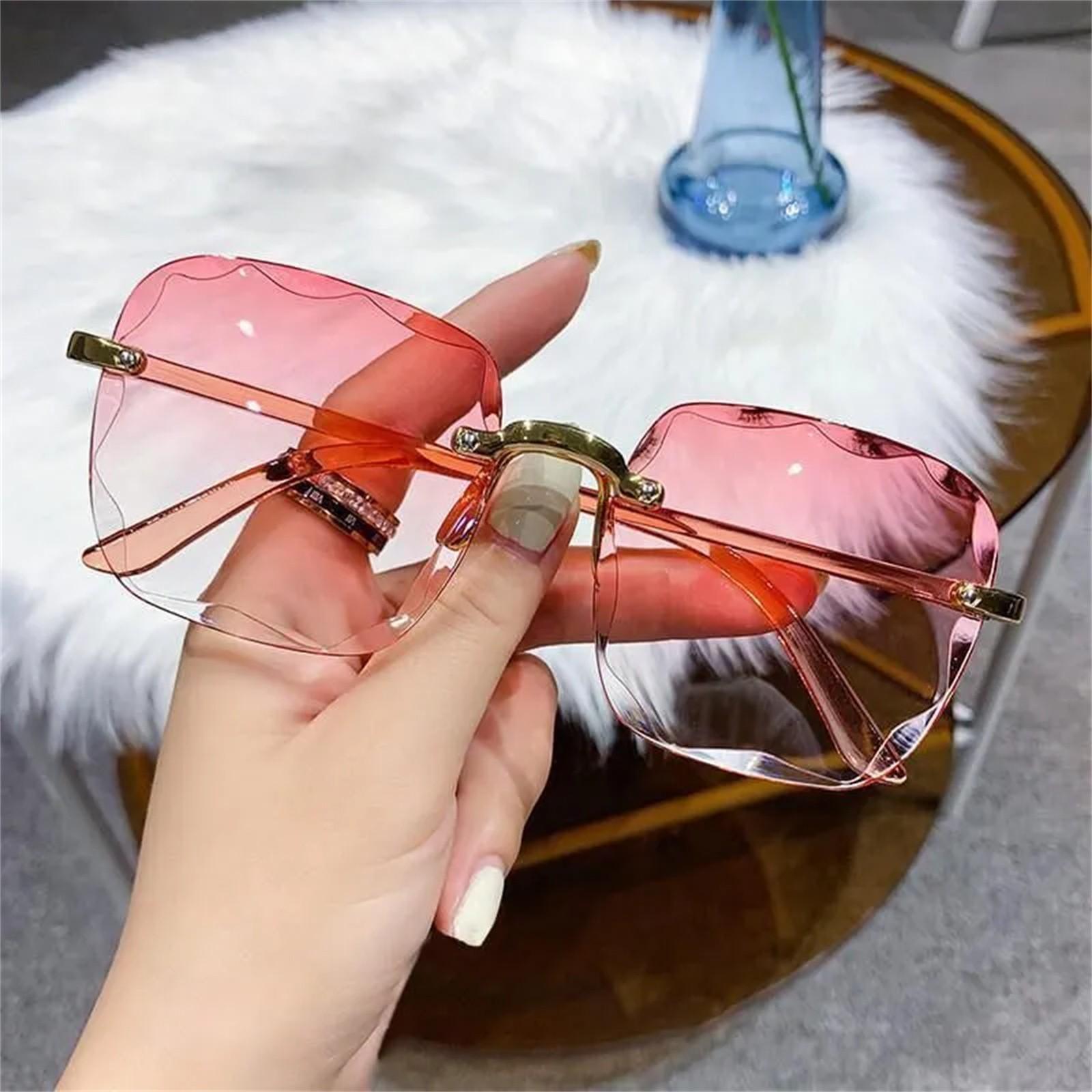 

Солнцезащитные очки без оправы в стиле ретро с овальной металлической оправой и модными цветовыми тонами One Size розовый