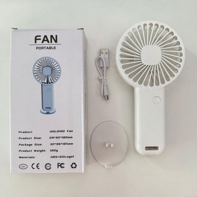 

Portable Mini Handheld Fan with USB Charging and Phone Holder Neutral Color Box Packaging