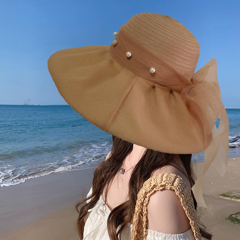 Hat women's new fashionable foreign style bow pearl mesh big eaves sunscreen hat elegant face small sale