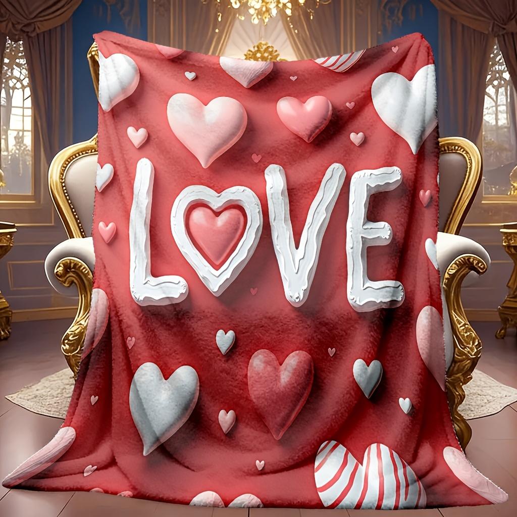 A Cozy Love-Themed Fleece Blanket Featuring a Soft, High-Definition Digital Print of Red Hearts And The Word 'LOVE'. Suitable for Year-Round Use! Made