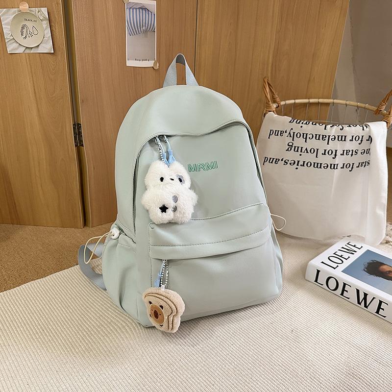 Cream school bag for female junior high school students, high-value niche computer travel backpack, simple and versatile college student backpack