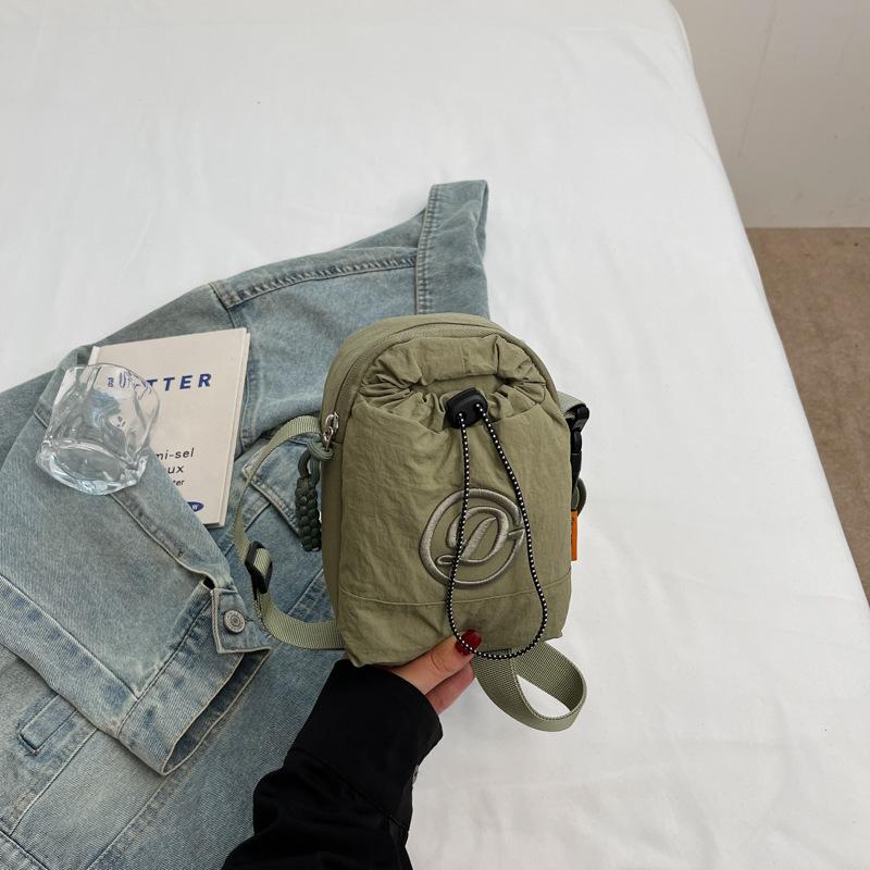 Mobile phone water cup integrated bag kettle bag Japanese women solid color shoulder bag commuter small satchel light travel bag