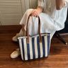 Large capacity fashionable hand-held straw bag women's new Korean version striped shoulder bag vacation leisure beach bag