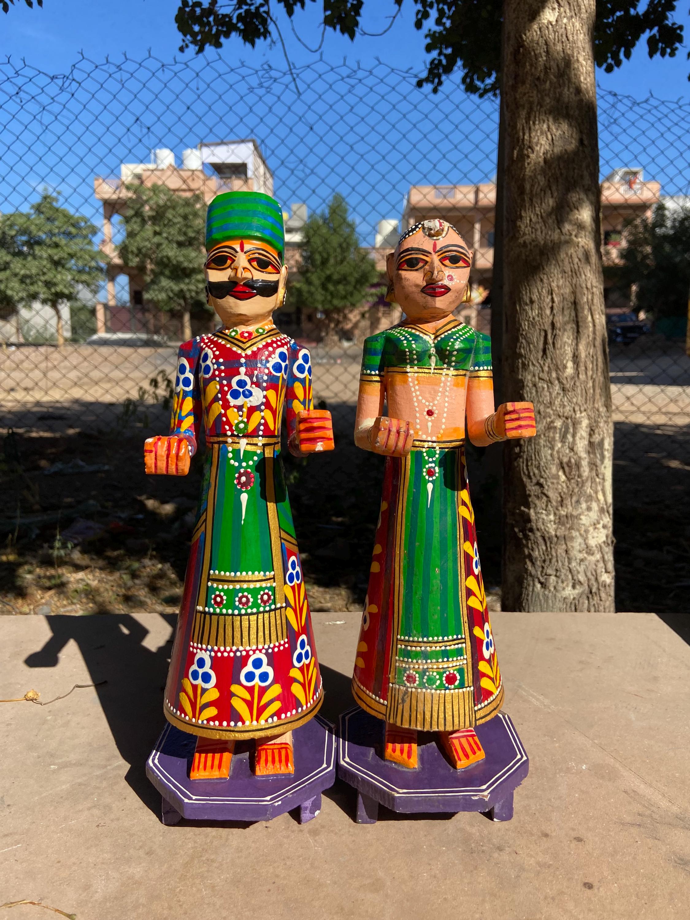 

Hand-Painted Wooden Isar Gangaur Statues: Rajasthani Festival Couple 16” X 8” X 24” (l x w x h) разноцветный