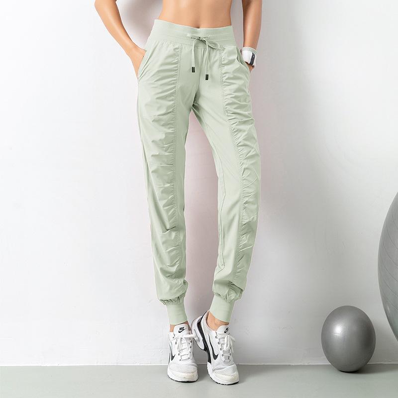Women's Quick-Dry Yoga Fitness Nine-Point Cuffed Pants with Pockets