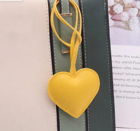leather heart-shaped bracelet, bag charm