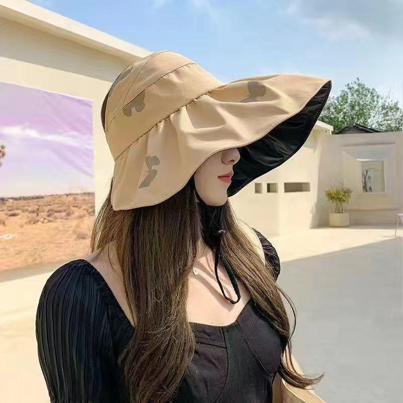 Women's Black Vinyl Bucket Hat with UV Face Shield, Adjustable & Foldable Summer Sun Protection Hat.
