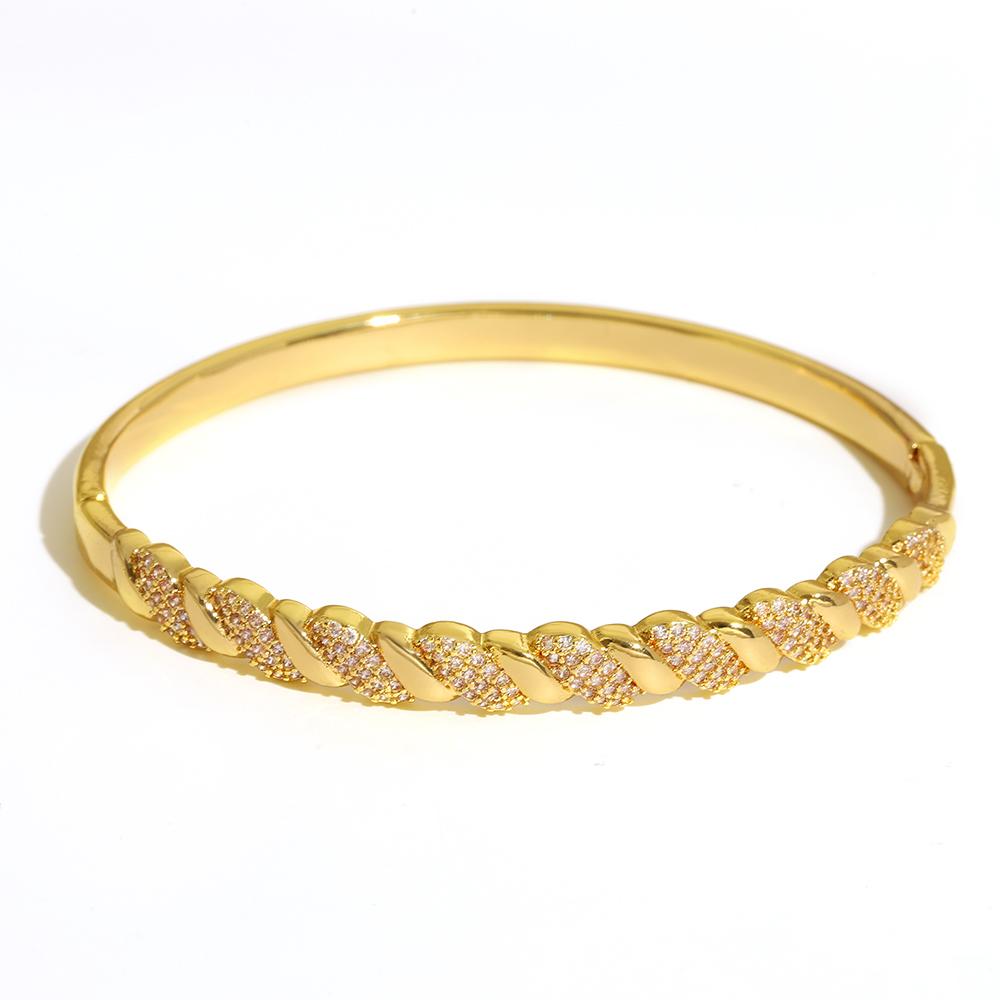 Luxuriöses funkelndes Strass-Armband, goldplattiert, für Damen, exquisites unregelmäßiges geometrisches Schleifenmanschetten-Federarmband Schmuck