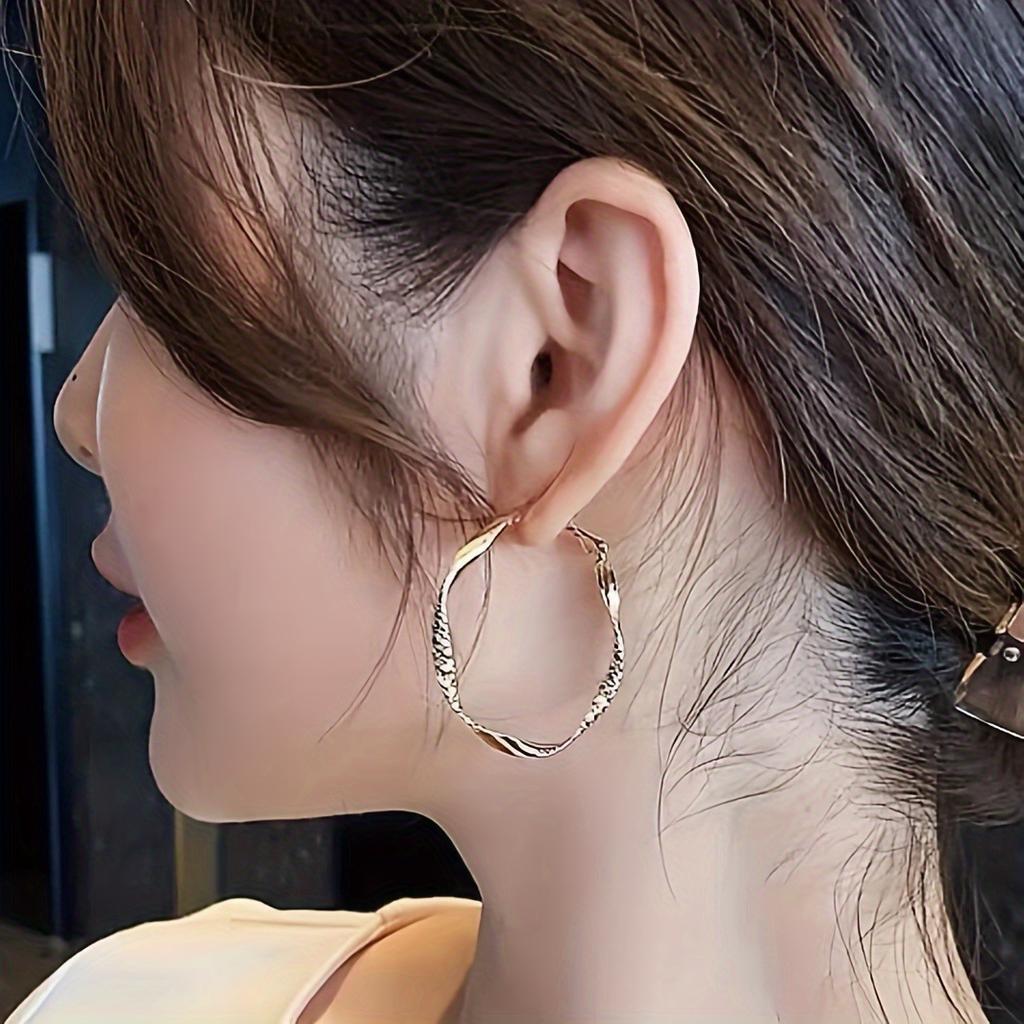 Fashionable and simple round twisted irregular ladies earrings exaggerated girls earrings high-grade plain hoop earrings