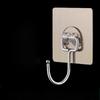 A Transparent Adhesive Wall-mounted Hook Without Drilling or Leaving Any Marks Is Pasted On The Wall Behind The Kitchen Door