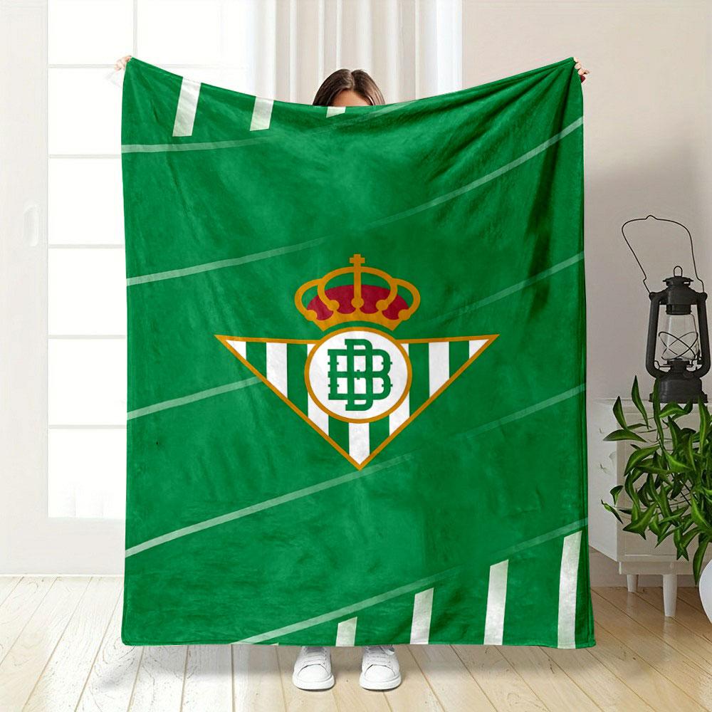 Diagonal green stripes with white accents and a central triangular logo. for all seasons blanket lunch break throw gift